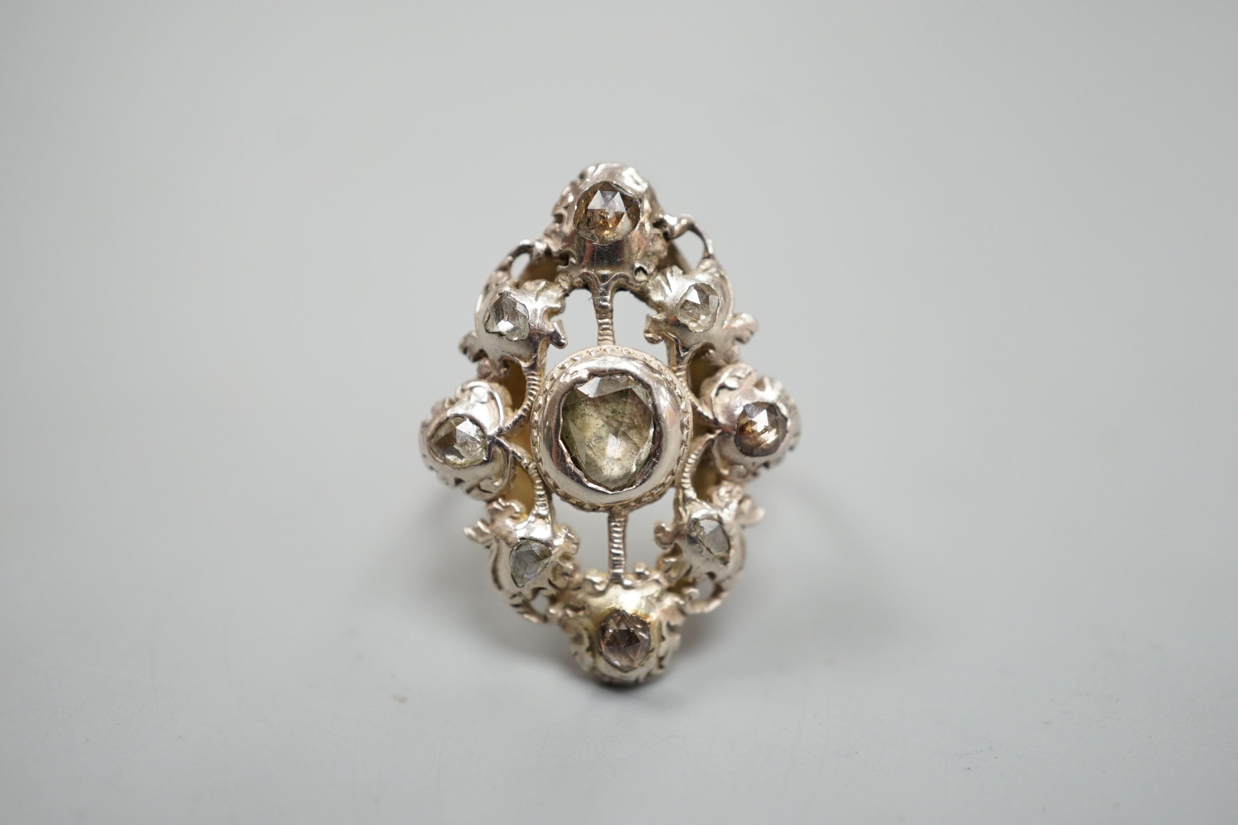 A pierced yellow and white metal, rose cut diamond cluster set ring (adapted?), size K, gross weight 6.1 grams.